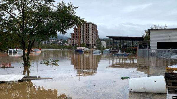 Vehicles are partially submerged following heavy rains in the town of Kiseljak, about twenty kilometres west of Sarajevo on Oct. 4, 2024. 